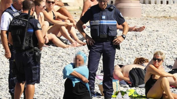 Burkini Ban: Police Make Woman Remove Clothing On Beach Promo Image