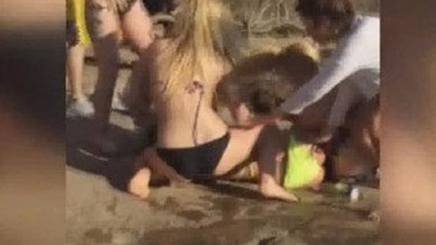 Chaos Erupts On Local Beach After Group Approaches Woman (Video) Promo Image