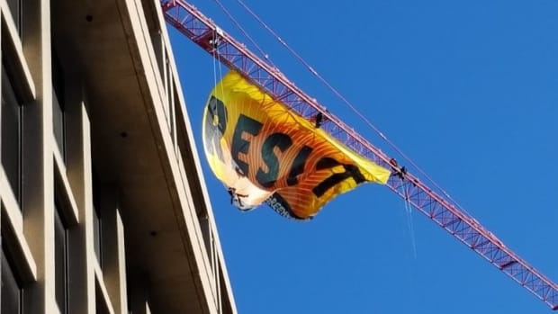 Activists Hang 'Resist' Banner Near White House Promo Image