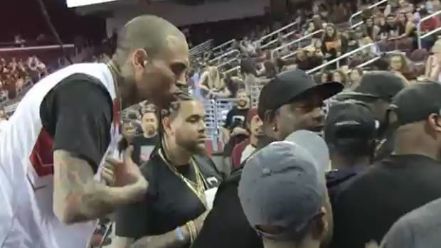 Chris Brown Fights With Fan, Is Stopped By Cops (Video) Promo Image