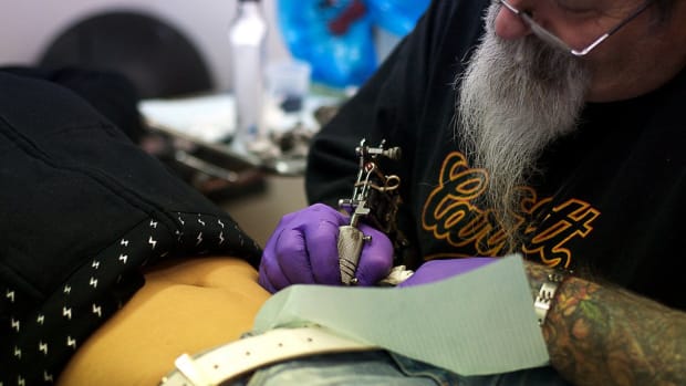 Woman's Old Tattoo Responsible For Cancer-Like Lumps Promo Image