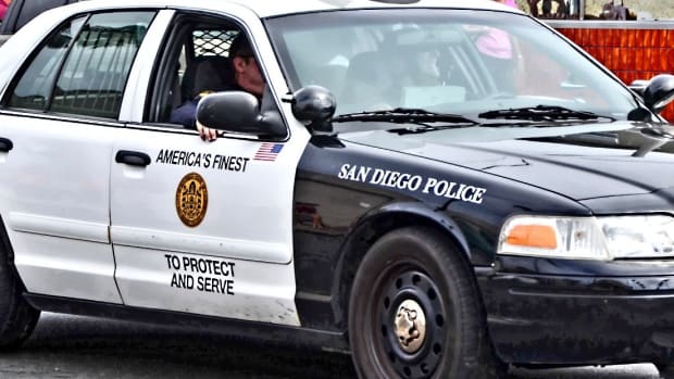 San Diego Cops Allow Dog To Bite Handcuffed Black Man (Video) Promo Image