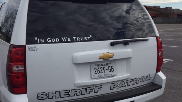 'In God We Trust' On A Police Vehicle.