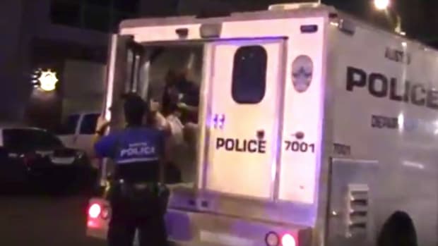 Cop Pepper Sprays Handcuffed Man In Police Van (Video) Promo Image