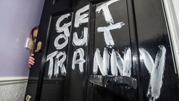 'Get Out Tranny' written on door