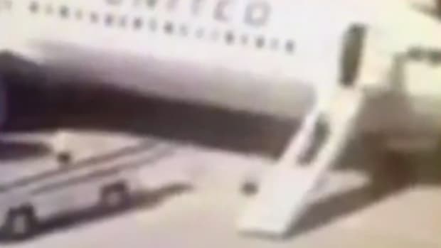Stewardess Pulls Emergency Slide, Leaves Plane (Video) Promo Image