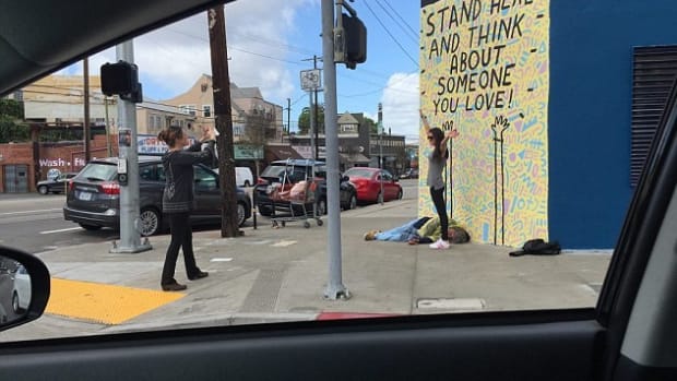 Woman’s Photo Triggers Debate On Homelessness Promo Image