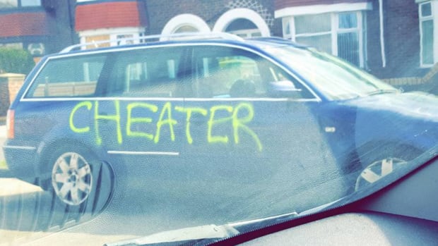 Man's Car Branded With 'Cheater' In Graffiti  Promo Image