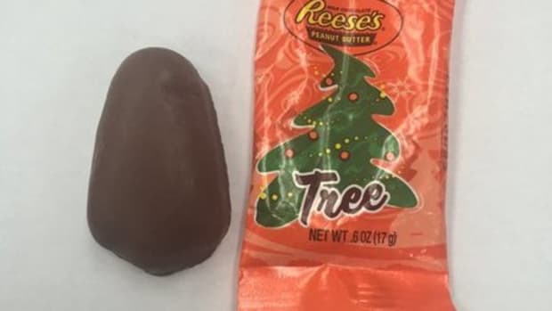 picture of Reese's Christmas tree peanut butter cup next to wrapper