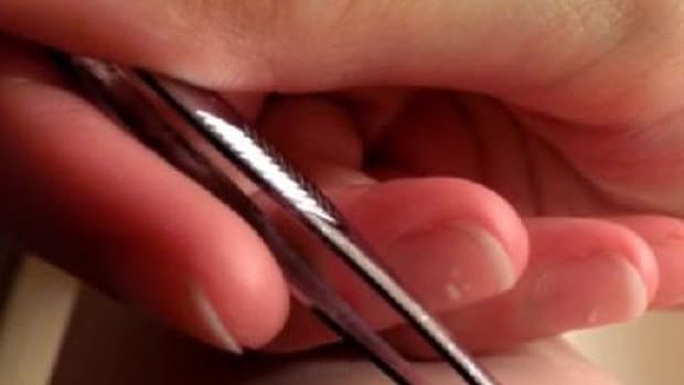 Young Woman Uses Pair Of Tweezers To Uncover What Had Been Causing Her Leg Pain (Video) Promo Image