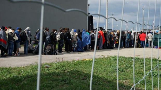Migrants wait to enter Germany