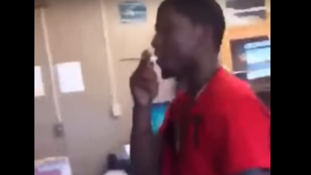 student blows smoke in teacher's face