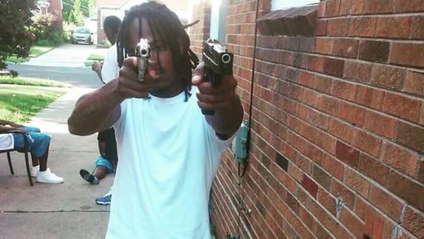 Denzel Biggs Appears To Hold Two Handguns In His Facebook Photo