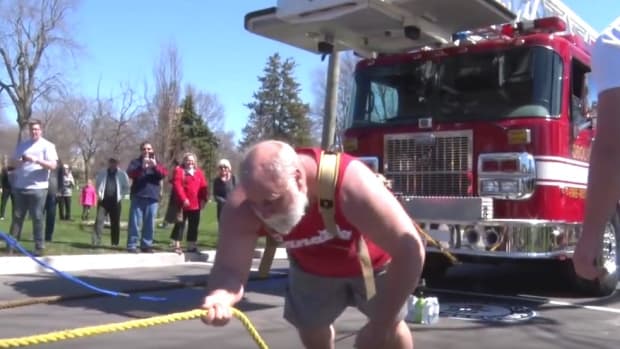 New World Record: Pair Pull Three Fire Trucks (Video) Promo Image