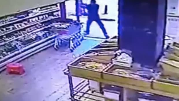 CCTV footage shows the shooter opening fire on a Tel Aviv bar from inside a neighboring grocery store on Jan. 1