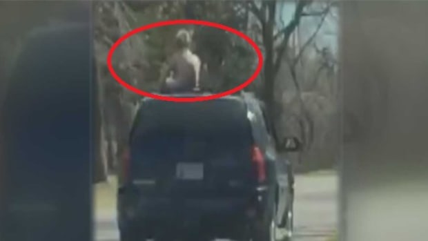 Mom Files Report After Son Filmed Riding On Top Of SUV Promo Image