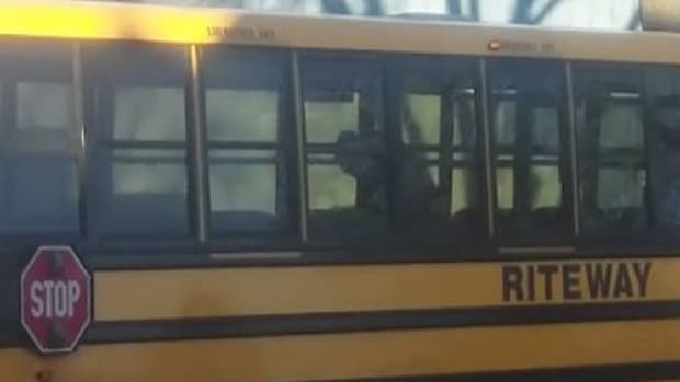 Figures seen on board a school bus allegedly having sex