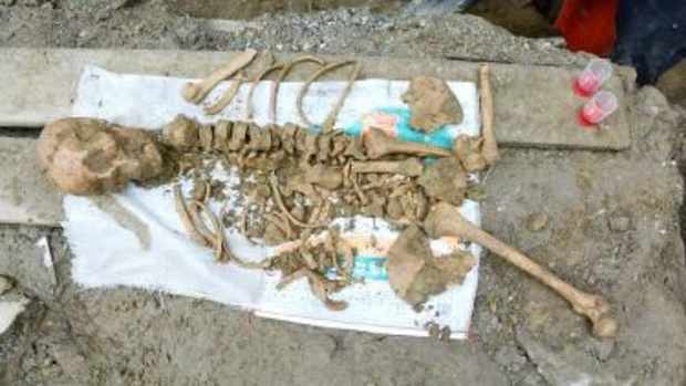 4,800-Year-Old Female Skeleton Cradling Baby Found Promo Image