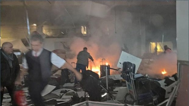 Brussels Attacks Kill 31, Police Raid Buildings Promo Image