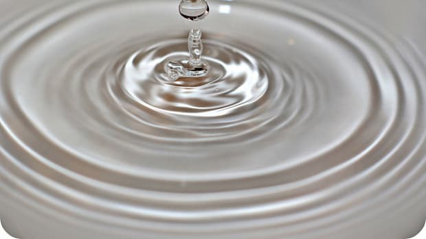 Water droplet falling from faucet