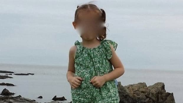 Parents Notice Something Frightening In Background Of Little Girl's Pic (Photo) Promo Image