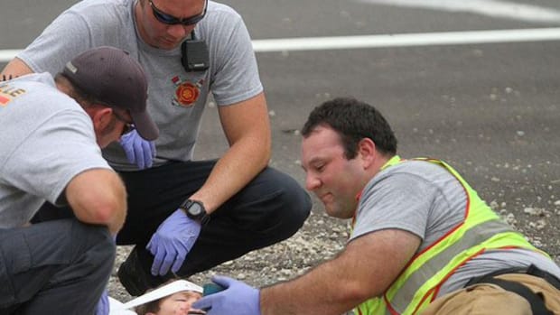 Firefighter Comforts Young Car Crash Victim With 'Happy Feet'