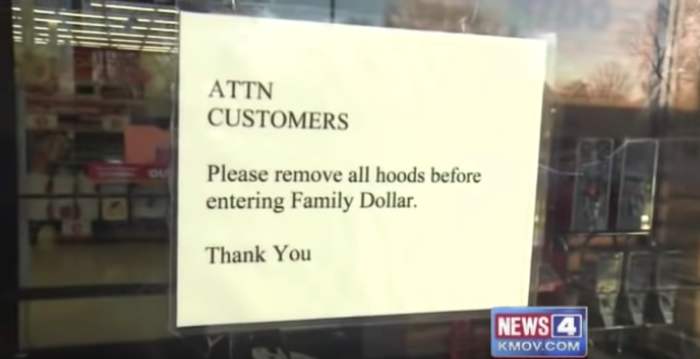 Closeup of the sign on the front door of Family Dollar that asks people to remove their hoods before entering, Photo Credit: LSUDVM