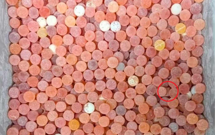 A tray full of round orange candies, Photo Credit: Minion Quotes/Facebook