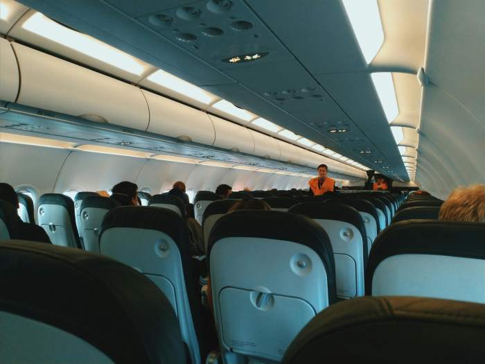 Cabin of aircraft with passengers on board, Photo Credit: Pexels