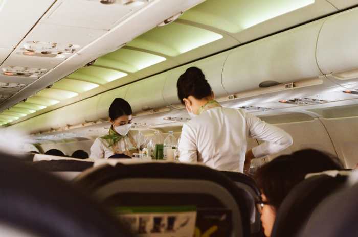Flight Attendants Standing in the Aisle of an Airplane, Photo Credit: Pexels