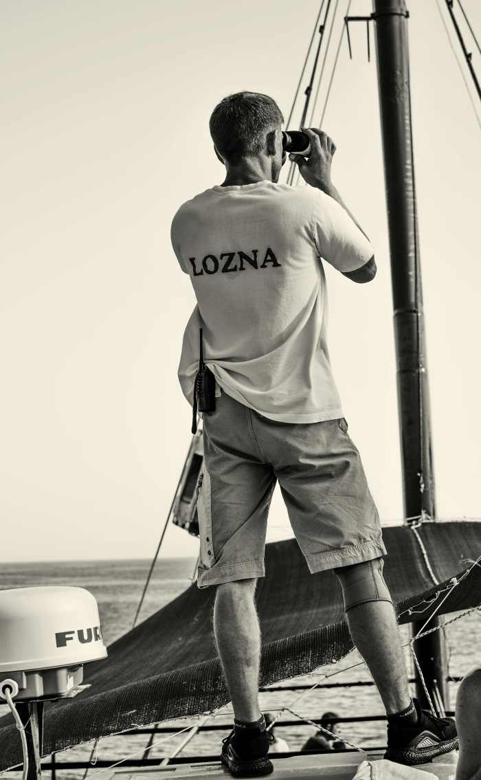 Man Looking through Binoculars on a Sailboat, Photo Credit: Pexels