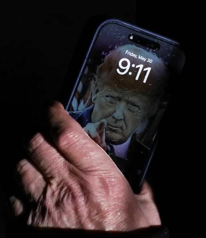 A closeup photo of President Trump’s Lock Screen on his iPhone, Photo Credit: johnny maga/X