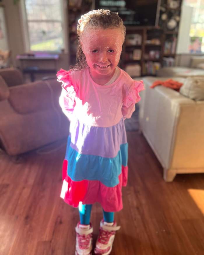Anna Wilklow wearing a colorful dress in a selfie posted on Instagram, Photo Credit: harlequindiva/Instagram
