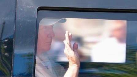 US President Donald Trump waving from inside of a car, Photo Credit: Globe Eye News/X