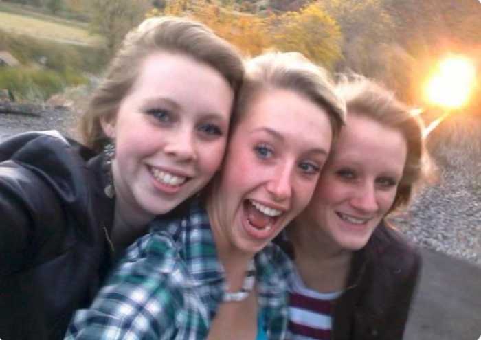 Selfie of Essa Ricker, Kelsea Webster, and Savannah Webster, seconds before they were hit and killed by the train in the background, Photo Credit: Creepy.org/X