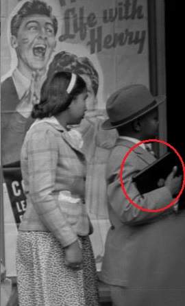 A boy holding what seems to be an iPad waiting in the movie line, Photo Credit: Reddit