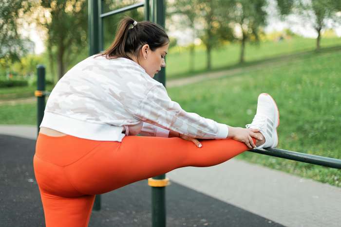Woman in Sportswear Stretching Her Leg, Photo Credit: Pexels