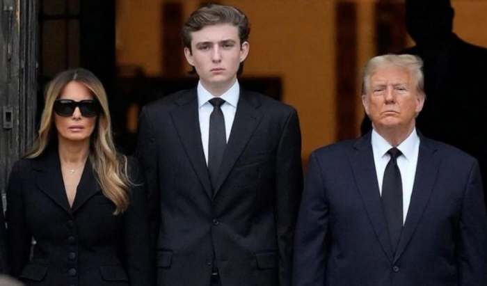 Barron Trump stands between his mother, Melania Trump, and father, Donald Trump, Photo Credit: SAY CHEESE!/X