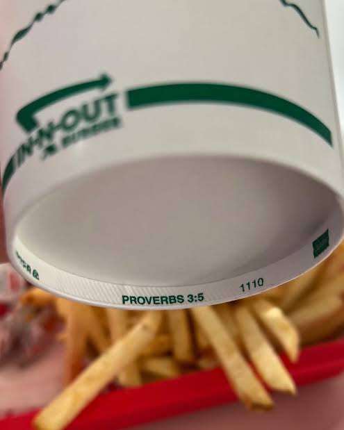 In-N-Out paper cup with a bible verse on its underside, Photo Credit: fan In-N-Out Burgers/X