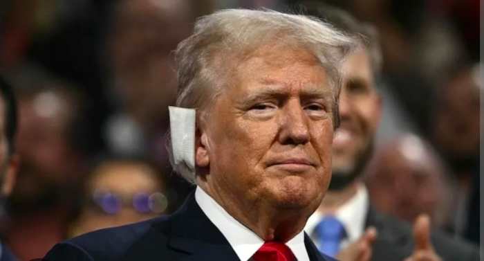 President Donald Trump wearing a bandage on his right ear following an assassination attempt in 2024, Photo Credit: I ❤️ acetaminofen/X