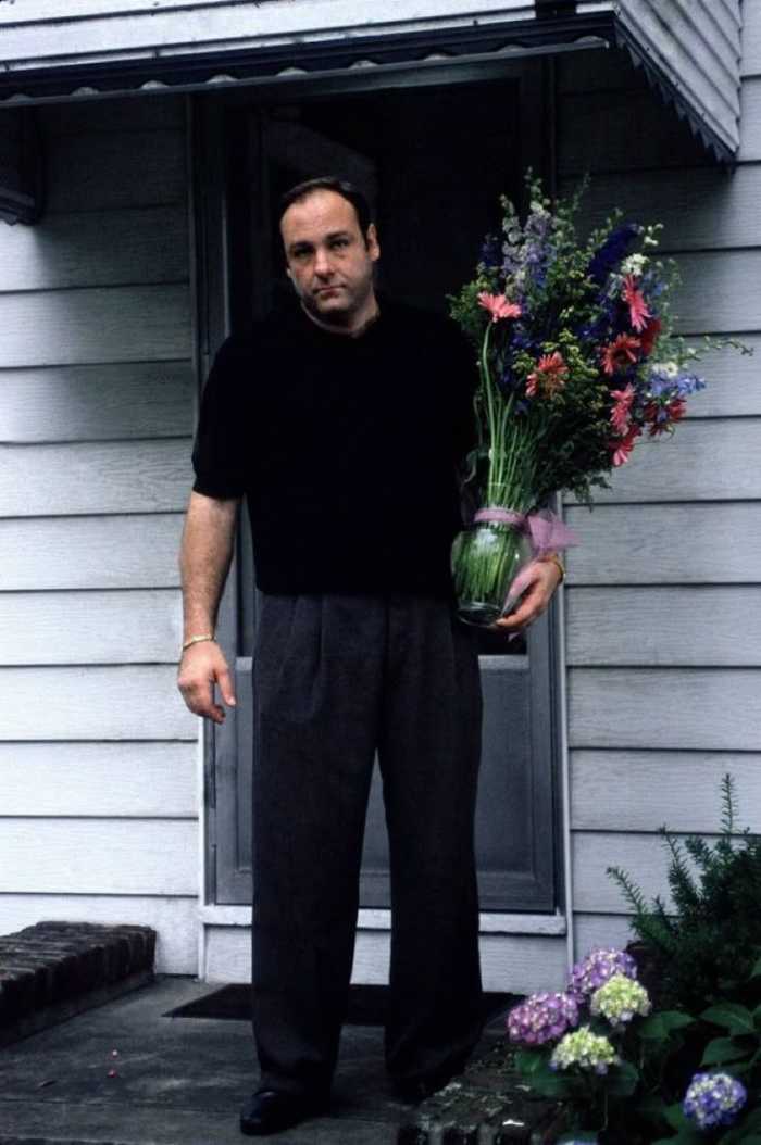 James Gandolfini as the character Tony Soprano holding a vase of flowers, Photo Credit: Witch/X
