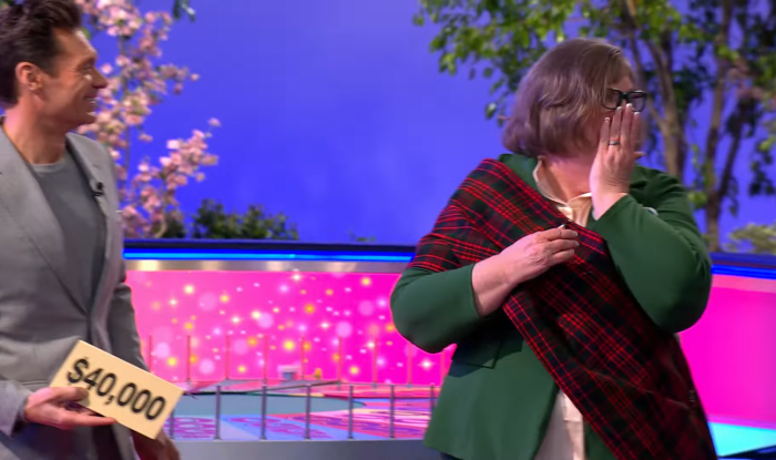 Show host Ryan Seacrest and Beth Barbee in a 'Wheel of Fortune' episode, Photo Credit: Wheel of Fortune/Youtube