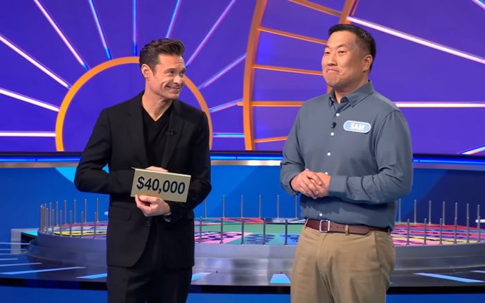 Show host Ryan Seacrest and contestant Sam Oh in a 'Wheel of Fortune' episode, Photo Credit: Wheel of Fortune/Youtube