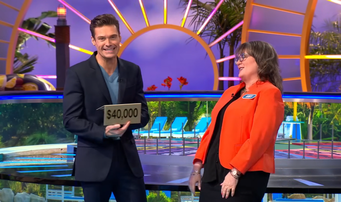Show host Ryan Seacrest and contestant Amy Johnston in a 'Wheel of Fortune' episode, Photo Credit: Wheel of Fortune/Youtube