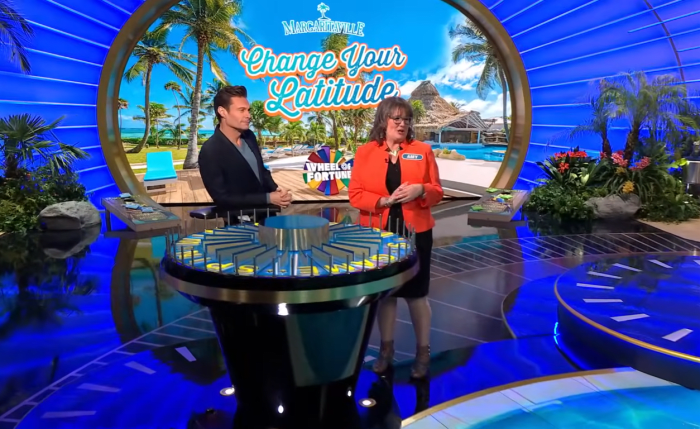 Show host Ryan Seacrest and contestant Amy Johnston in a 'Wheel of Fortune' episode, Photo Credit: Wheel of Fortune/Youtube