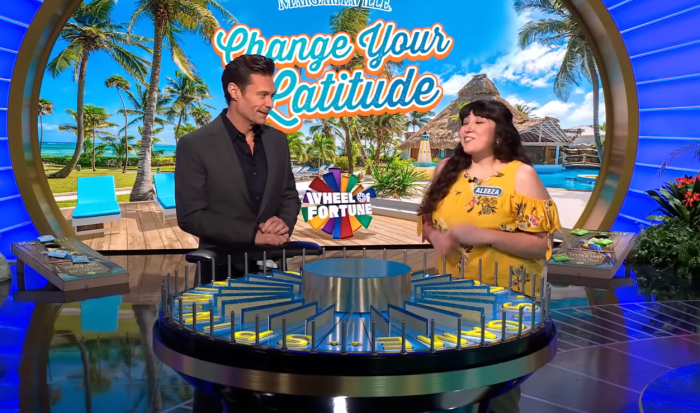 Show host Ryan Seacrest and contestant Aleeza Santillan in a 'Wheel of Fortune' episode, Photo Credit: Wheel of Fortune/Youtube