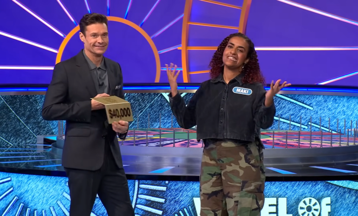 Show host Ryan Seacrest and contestant Maki Asrat in a 'Wheel of Fortune' episode, Photo Credit: Wheel of Fortune/Youtube