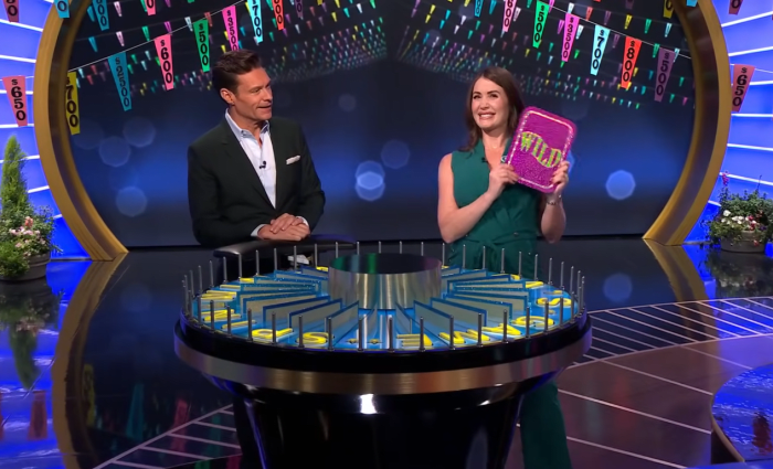 Show host Ryan Seacrest and contestant Sheree Corder in a 'Wheel of Fortune' episode, Photo Credit: Wheel of Fortune/Youtube