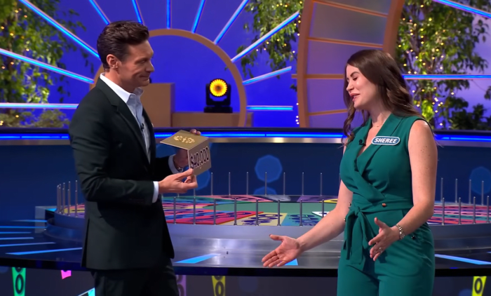Show host Ryan Seacrest and contestant Sheree Corder in a 'Wheel of Fortune' episode, Photo Credit: Wheel of Fortune/Youtube
