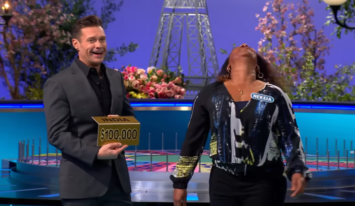 Show host Ryan Seacrest and contestant Nekeia Borders in a 'Wheel of Fortune' episode, Photo Credit: Wheel Of Fortune/Youtube